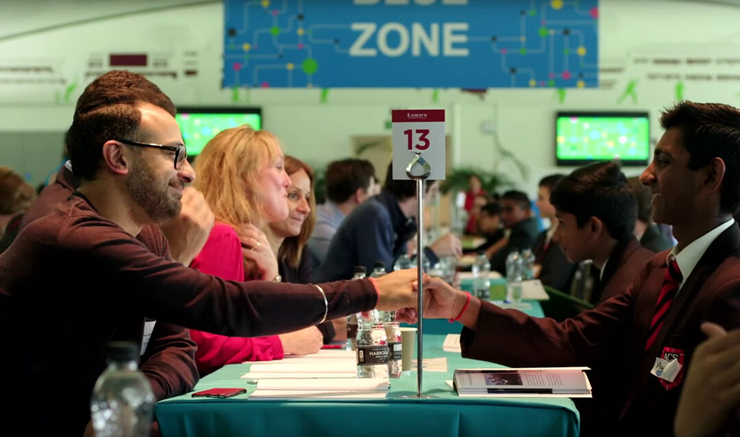 Students shaking hands with employers