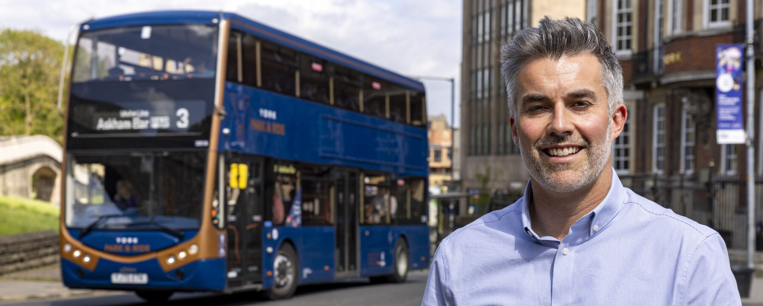 David Skaith in front of a bus in York