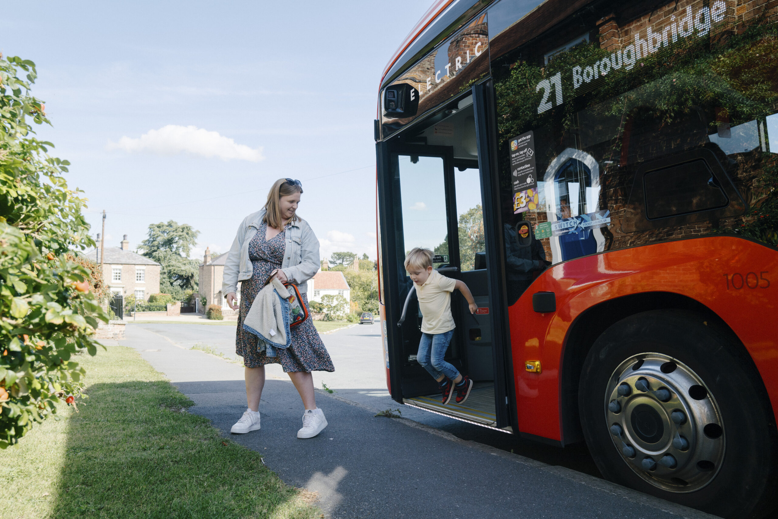 VNY_TransDev_Knares_Sept_2025_Tom-Arber-(154-of-214) Mother and son jumping off a bus in Boroughbridge, North Yorkshire